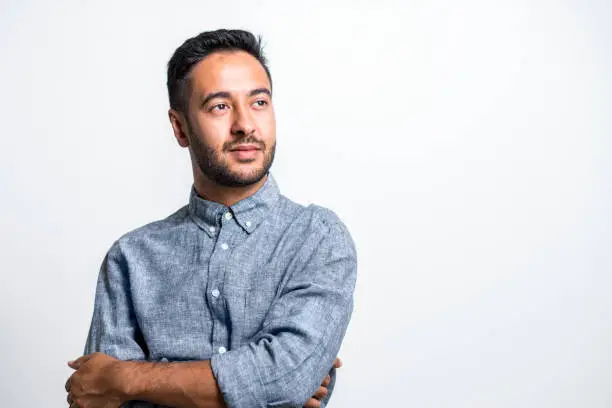 Photo of Thoughtful businessman against white background