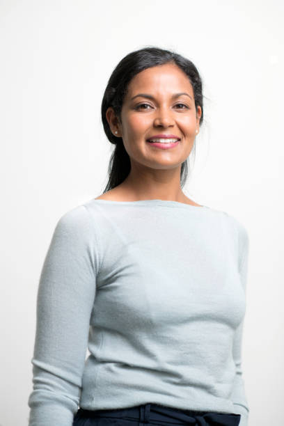 istock Confident creative woman smiling on white 1074865070