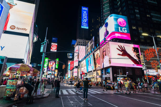 Times Square at night in New York City, USA stock photo