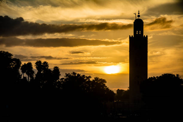 istock Marrakesh mosque in silhouette at sundown in Morocco 1074867848