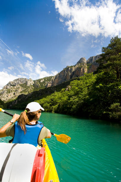 istock woman kayaking on the river 1074869852