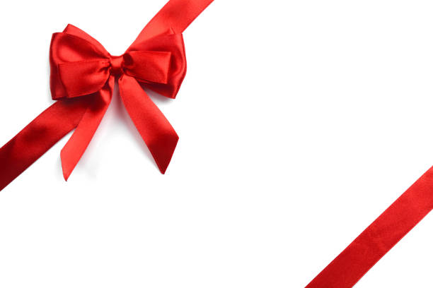 istock Shiny red satin ribbon on white background 1074870538