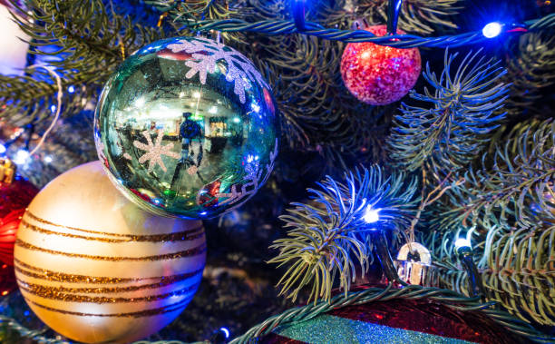 istock Christmas tree with beautiful xmas decoration in blurry background, bokeh, close up, copy space(text space) 1074872292