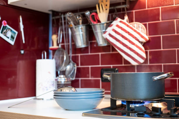 istock cooking pot on gas stove with blue dishes ready on the side 1074875882