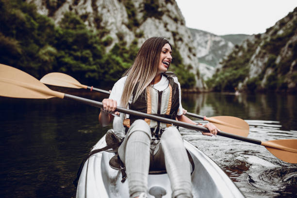 istock Couple Learning How To Kayaking On a Mounting Lake 1074877948