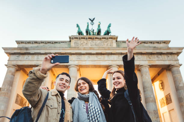 istock Friends at Brandeburg Gate in Berlin take a selfie 1074881240