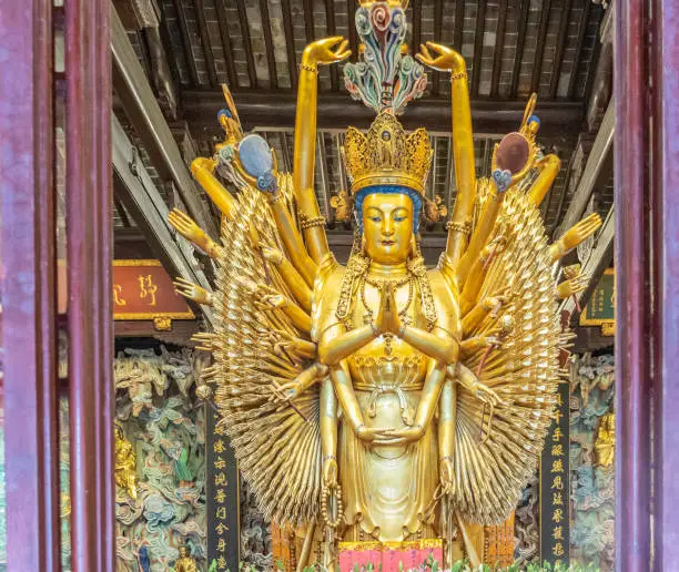 Photo of Guanyin.Gold statues of the Lohans in Longhua buddhist temple, Shanghai, China.