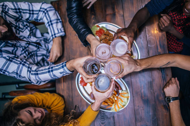 istock Friends having a toast in pub 1074884596