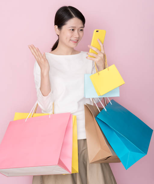 istock Asian female on pink background 1074886610