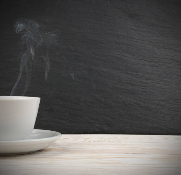 istock Mockup with white cup of coffee and steam 1074886744