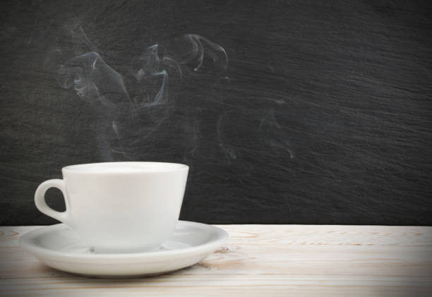 istock Mockup with white cup of coffee and steam 1074886754