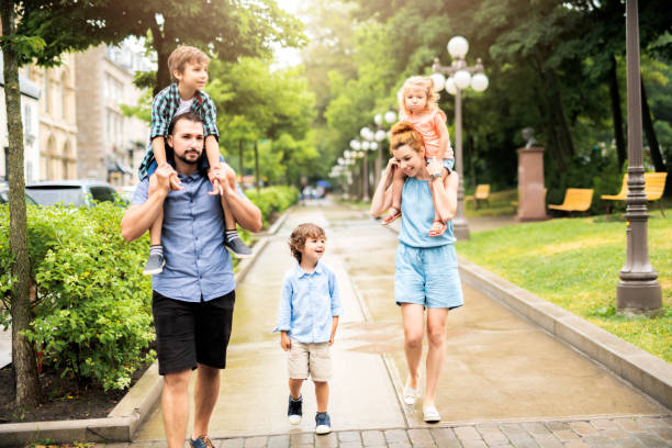 istock Happy familly in the park 1074887132