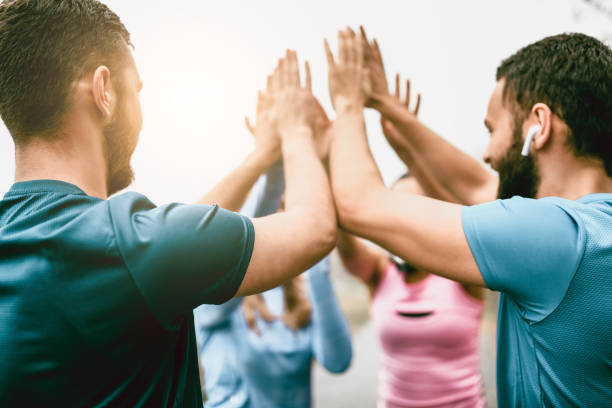 istock Sport Team Celebrating With Collective High Five 1074888130