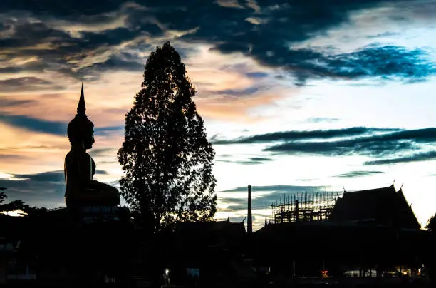 Photo of Sunset behind Wat Lad Pha Dook , Temple in Nonthaburi , Thailand.