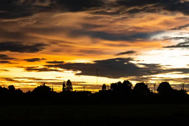 Photo of Sunset behind Wat Lad Pha Dook , Temple in Nonthaburi , Thailand.