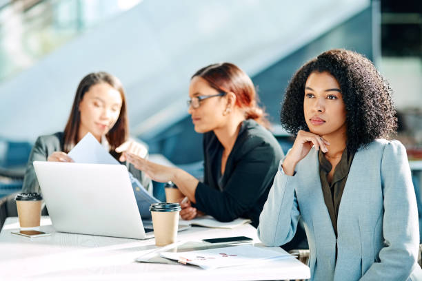 My ideas are not being heard Cropped shot of young businesswomen having a meeting in the convention centre indifference stock pictures, royalty-free photos & images