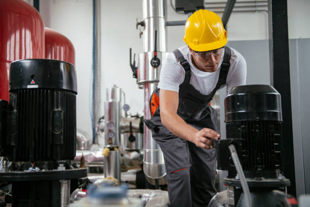 istock Man working in a boiler room 1074899320