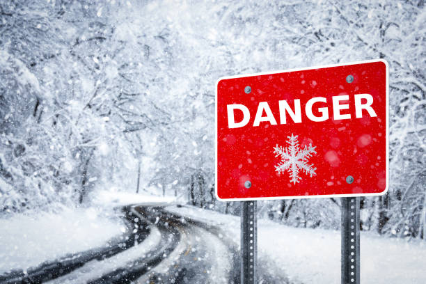 istock Warning traffic sign on a ice road 1074899440