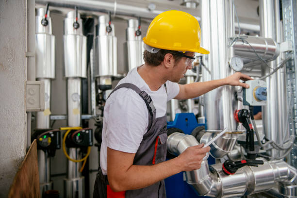 istock Man working in a boiler room 1074901136