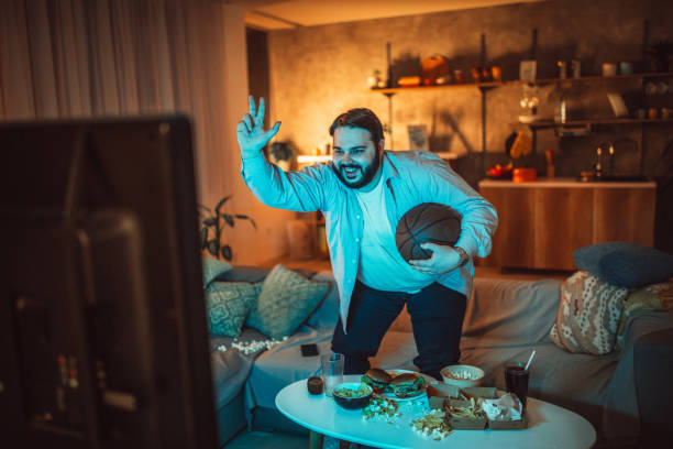 istock Guy watching a basketball match 1074905378