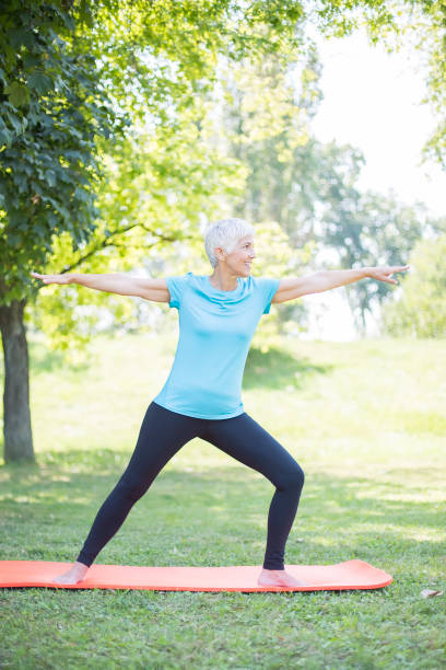 istock Senior lady enhancing body flexibility by stretching 1074907148