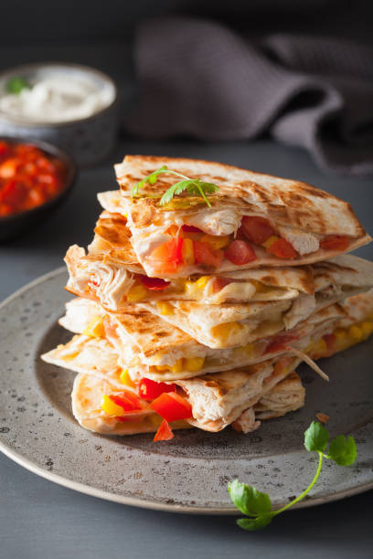 istock mexican quesadilla with chicken, tomato, sweet corn and cheese 1074909608