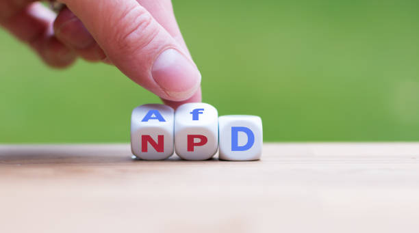 Hand turns dices and changes the name of the german party "NPD" to "AfD" Hand turns dices and changes the name of the german party "NPD" to "AfD" national democratic party of germany stock pictures, royalty-free photos & images
