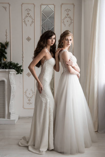 istock Two girls models in wedding dresses. 1074910704