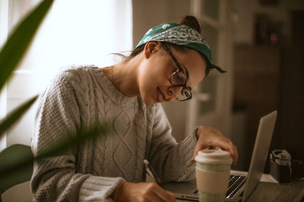 Girl working from her home office stock photo