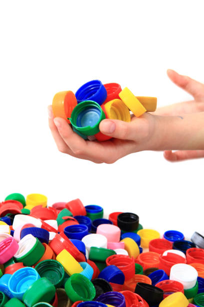 istock color plastic caps in human hands 1074914984