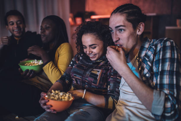 istock Friends eating popcorns 1074915558