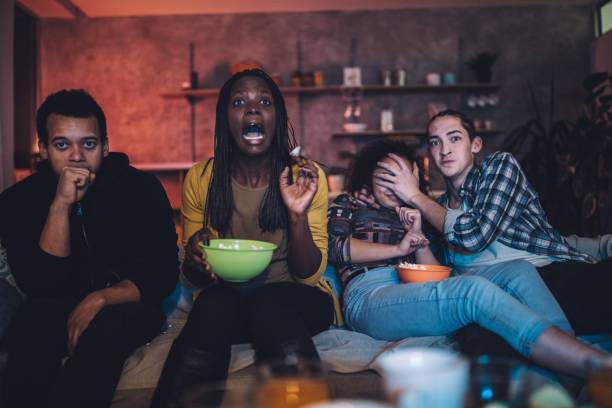 istock Friends watching a scary movie 1074915672
