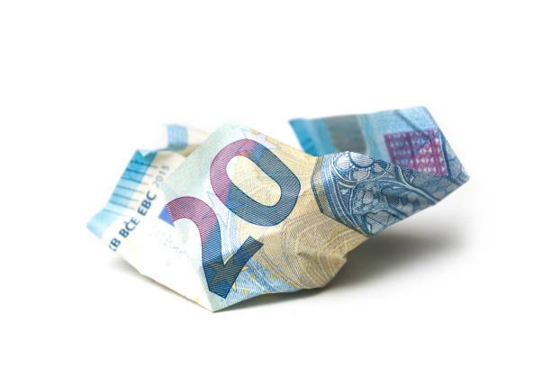 istock crumpled  twenty euros banknote on white background 1074918110