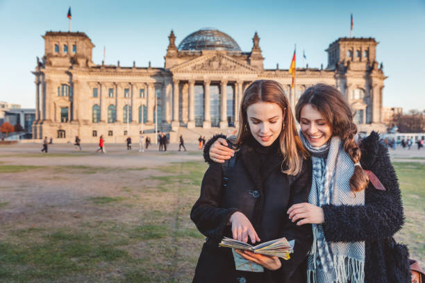 istock tourist in Berlin reading the tourist map 1074918708