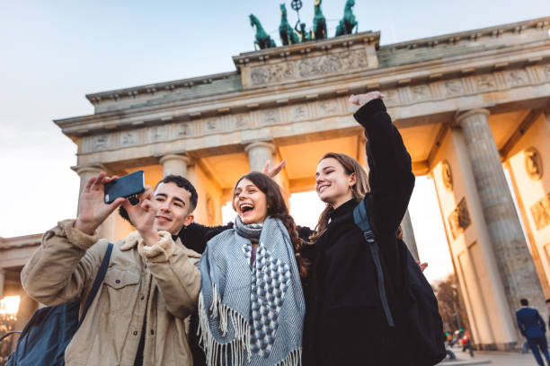 istock Friends at Brandeburg Gate in Berlin take a selfie 1074919128
