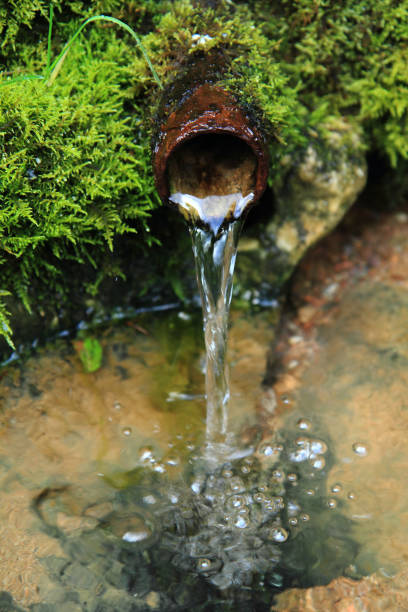 istock old fountain in the green moss 1074920190