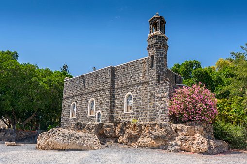 Rock with famous church Agios Ioannis Kastri on Skopelos island, Greece at sunset, where scenes of Mamma Mia! movie were filmed.