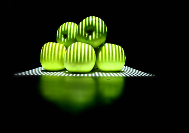 green apples in the dark night with light