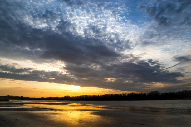 istock beautiful sunset on the riverbank cloudy evening 1074933042