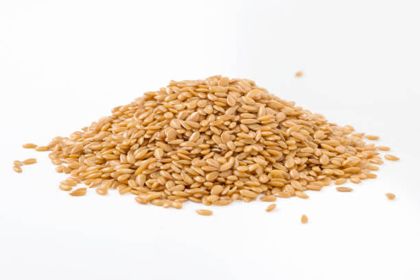 istock Golden flaxseed isolated on white 1074934398