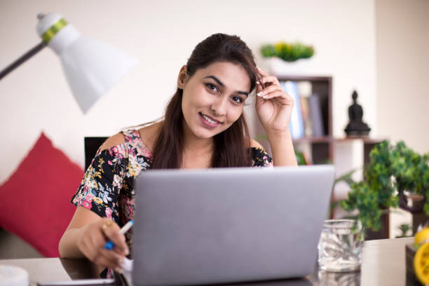 istock Woman working on laptop at home 1074936956