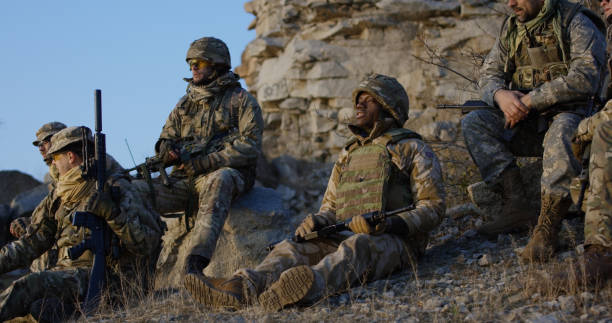 Soldiers sitting during a break in an assault