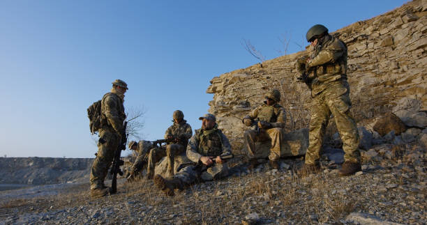 istock Soldiers sitting during a break in an assault 1074937266