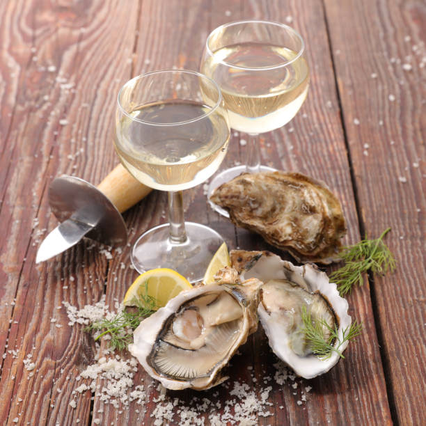 istock oyster and wine glasses 1074940002