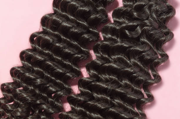 Deep Curly Black Human Hair Weaves Extensions Bundles Upon Pink Background  Stock Photo - Download Image Now - iStock