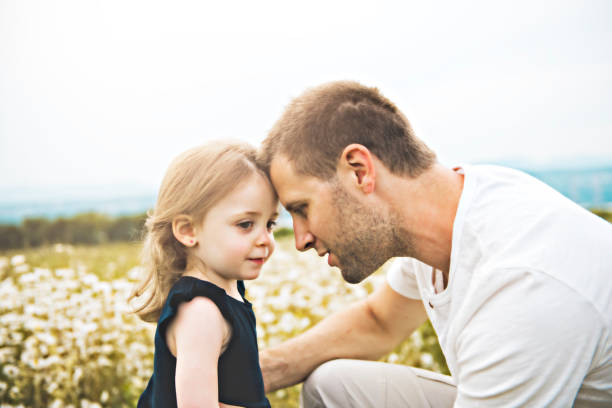 istock Father spending time with daughter during the sunset. 1074949374