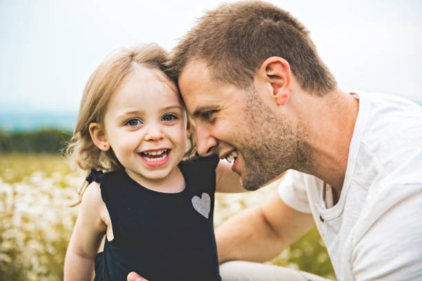 istock Father spending time with daughter during the sunset. 1074949414