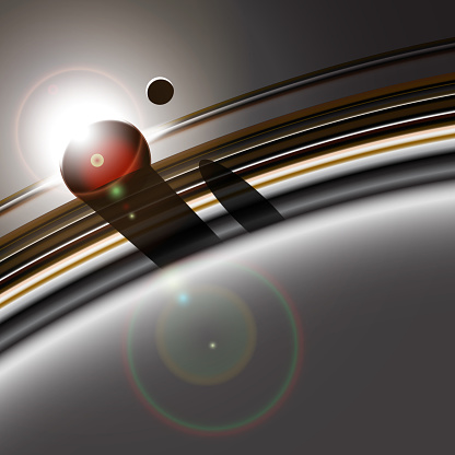 Gas giant's ring system and it's moon interacting. Star or sun eclipse. Deep space abstract background.