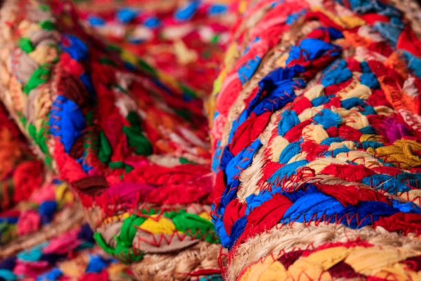 istock Colorful fabric stacks detail view close up 1074955076