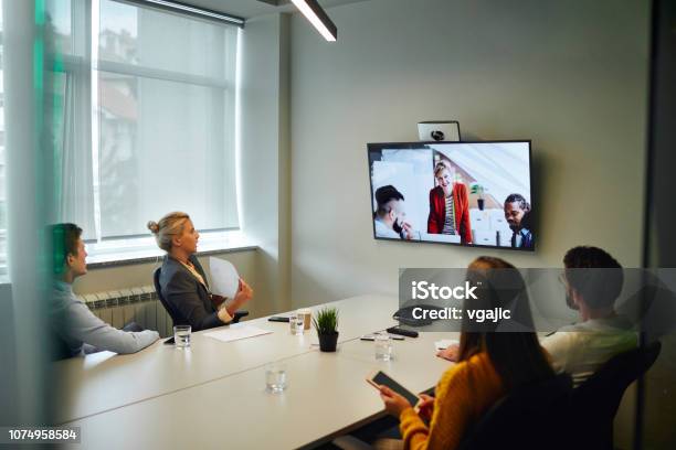 Business People Having A Video Call Stock Photo - Download Image Now - Business Meeting, Meeting, Meeting Room